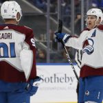 
              Colorado Avalanche center Nathan MacKinnon, right, celebrates his goal against the New York Islanders during the third period of an NHL hockey game with teammate Nazem Kadri (91) on Monday, March 7, 2022, in Elmont, N.Y. (AP Photo/Jim McIsaac)
            