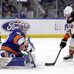 
              New York Islanders goaltender Ilya Sorokin (30) makes a save on a shot by Anaheim Ducks left wing Sonny Milano (12) in the third period of an NHL hockey game Sunday, March 13, 2022, in Elmont, N.Y. (AP Photo/Adam Hunger)
            