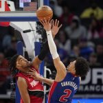 
              Detroit Pistons guard Cade Cunningham, right, drives on Portland Trail Blazers forward Trendon Watford in the second half of an NBA basketball game in Detroit, Monday, March 21, 2022. (AP Photo/Paul Sancya)
            