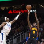 
              Atlanta Hawks guard Lou Williams (6) shoots over Los Angeles Clippers guard Terance Mann (14) during the second half of an NBA basketball game Friday, March 11, 2022, in Atlanta. (AP Photo/Hakim Wright Sr.)
            