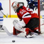 
              New Jersey Devils goaltender Nico Daws (50) keeps an eye on the puck after stoping a shot against the Winnipeg Jets during the second period of an NHL hockey game Thursday, March 10, 2022, in Newark, N.J. (AP Photo/Eduardo Munoz Alvarez)
            