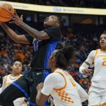 
              Kentucky's Dre'una Edwards (44) drives ahead of Tennessee's Jordan Walker (4) and Alexus Dye (2) in the first half of an NCAA college basketball semifinal round game at the women's Southeastern Conference tournament Saturday, March 5, 2022, in Nashville, Tenn. (AP Photo/Mark Humphrey)
            