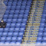 
              FILE - An observer of a hockey match between the American Hockey League's Wilkes-Barre Scranton Penguins and the Binghamton Devils sits alone in the stands during the Penguins home opener at the Mohegan Sun Arena at Casey Plaza in Wilkes-Barre Twp, Pa., Monday, Feb. 8, 2021. Due to COVID-19 restrictions, only players, media and essential personnel were allowed in for the match. More than a hundred Minor League Baseball and over a dozen minor league hockey teams at various levels are hoping for some badly needed COVID-19 relief from the U.S. government, which could get through Congress as early as next week. (Dave Scherbenco/The Citizens' Voice via AP, File)
            