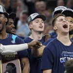 
              Villanova guard Collin Gillespie, right, celebrates after their win against Houston during a college basketball game in the Elite Eight round of the NCAA tournament on Saturday, March 26, 2022, in San Antonio. (AP Photo/David J. Phillip)
            