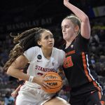 
              Stanford guard Haley Jones (30) drives with the ball as Oregon State forward Ellie Mack (20) defends during an NCAA college basketball game in the quarterfinals of the Pac-12 women's tournament Thursday, March 3, 2022, in Las Vegas. (AP Photo/David Becker)
            