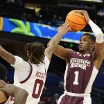 
              Mississippi State guard Iverson Molinar (1) shoots over South Carolina guard James Reese V (0) during the first half of an NCAA men's college basketball game at the Southeastern Conference tournament in Tampa, Fla., Thursday, March 10, 2022. (AP Photo/Chris O'Meara)
            