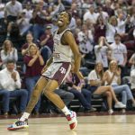 
              Texas A&M's Quenton Jackson celebrates after a dunk during the first half of an NCAA college basketball game against Wake Forest in the third round of the NIT in College Station, Texas, Wednesday, March 23, 2022. (Michael Miller/College Station Eagle via AP)
            