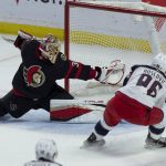 
              Columbus Blue Jackets center Jack Roslovic slides the puck past Ottawa Senators goaltender Anton Forsberg to score during the first period of an NHL hockey game Wednesday, March 16, 2022 in Ottawa, Ontario.(Adrian Wyld/The Canadian Press via AP)
            