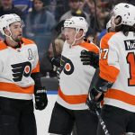 
              Philadelphia Flyers' Patrick Brown, center, is congratulated by teammates Ivan Provorov (9) and Zack MacEwen (17) after scoring during the first period of an NHL hockey game against the St. Louis Blues Thursday, March 24, 2022, in St. Louis. (AP Photo/Jeff Roberson)
            