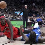 
              Toronto Raptors forward Pascal Siakam (43) and Minnesota Timberwolves forward Taurean Prince (12) fall to the court after a collision during the first half of an NBA basketball game Wednesday, March 30, 2022, in Toronto. (Nathan Denette/The Canadian Press via AP)
            