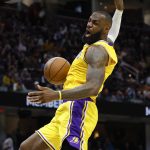 
              Los Angeles Lakers' LeBron James dunks against the Cleveland Cavaliers during the second half of an NBA basketball game, Monday, March 21, 2022, in Cleveland. (AP Photo/Ron Schwane)
            