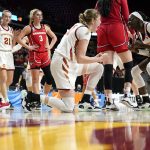 
              Iowa State forward Morgan Kane, center, celebrates with teammate Nyamer Diew, right, after making a basket during the second half of a second-round game against Georgia in the NCAA women's college basketball tournament, Sunday, March 20, 2022, in Ames, Iowa. (AP Photo/Charlie Neibergall)
            