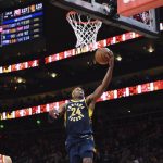 
              Indiana Pacers guard Buddy Hield (24) scores during the second half of an NBA basketball game against the Atlanta Hawks, Sunday, March 13, 2022, in Atlanta. (AP Photo/Hakim Wright Sr.)
            
