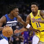 
              Minnesota Timberwolves forward Anthony Edwards (1) drives on Los Angeles Lakers guard Malik Monk (11) during the first half of an NBA basketball game Wednesday, March 16, 2022, in Minneapolis. (AP Photo/Andy Clayton-King)
            