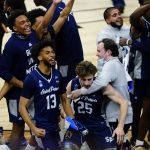 
              Saint Peter's players celebrate after winning a college basketball game against Purdue in the Sweet 16 round of the NCAA tournament, Friday, March 25, 2022, in Philadelphia. (AP Photo/Matt Slocum)
            