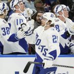 
              Tampa Bay Lightning center Brayden Point (21) celebrates with the bench after scoring against the New York Rangers during the first period of an NHL hockey game Saturday, March 19, 2022, in Tampa, Fla. (AP Photo/Chris O'Meara)
            