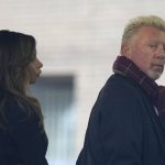 
              Former Wimbledon tennis champion Boris Becker, right, looks back as he waits in a queue to get into Southwark Crown Court in London, Monday, March 21, 2022. Becker is in court accused of filing to hand over trophies from his glittering tennis career to settle debts, relating to charges over his bankruptcy. (AP Photo/Alastair Grant)
            