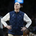 
              Akron head coach John Groce looks up from the bench during the first half of a first-round NCAA college basketball tournament game against UCLA, Thursday, March 17, 2022, in Portland, Ore. (AP Photo/Craig Mitchelldyer)
            