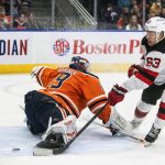 
              New Jersey Devils' Jesper Bratt (63) scores a goal on Edmonton Oilers' goalie Mikko Koskinen (19) during the first period of an NHL hockey game in Edmonton, Alberta, Saturday, March 19, 2022. (Jason Franson/The Canadian Press via AP)
            