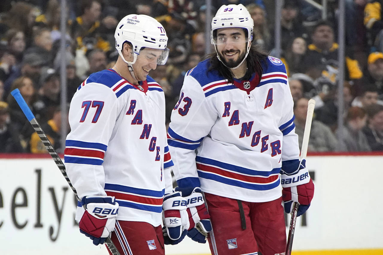 New York Rangers' Frank Vatrano (77) celebrates with Mika Zibanejad after scoring during the second...