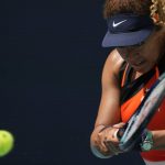 
              Naomi Osaka of Japan eyes an incoming ball in her first round women's match against Astra Sharma of Australia, at the Miami Open tennis tournament, Wednesday, March 23, 2022, in Miami Gardens, Fla. (AP Photo/Rebecca Blackwell)
            