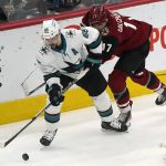
              San Jose Sharks' Erik Karlsson (65) controls the puck against Arizona Coyotes' Alex Galchenyuk (17) during the second period of an NHL hockey game Wednesday, March 30, 2022, in Glendale, Ariz. (AP Photo/Darryl Webb)
            