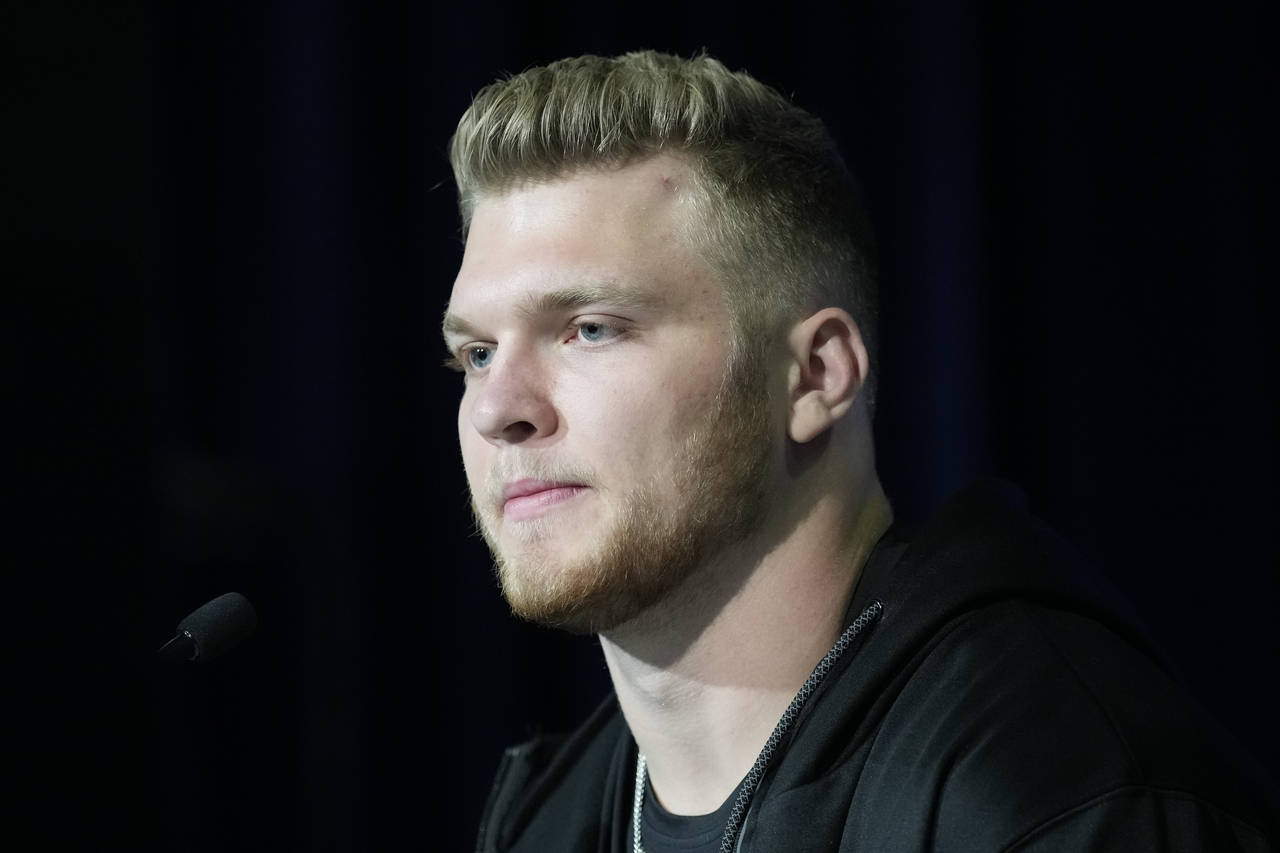 Michigan defensive lineman Aidan Hutchinson speaks during a press conference at the NFL football sc...