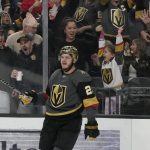 
              Vegas Golden Knights center Mattias Janmark (26) celebrates after scoring against the Los Angeles Kings during the second period of an NHL hockey game Saturday, March 19, 2022, in Las Vegas. (AP Photo/John Locher)
            