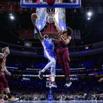 
              Philadelphia 76ers' Joel Embiid, left, goes up for a shot against Cleveland Cavaliers' Jarrett Allen during the first half of an NBA basketball game, Friday, March 4, 2022, in Philadelphia. (AP Photo/Matt Slocum)
            
