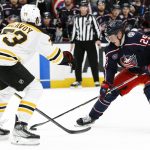 
              Columbus Blue Jackets' Patrik Laine, right, tries to skate past Boston Bruins' Charlie McAvoy during the overtime period of an NHL hockey game Saturday, March 5, 2022, in Columbus, Ohio. (AP Photo/Jay LaPrete)
            