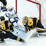 
              Boston Bruins goaltender Jeremy Swayman (1) makes a save on a shot by Tampa Bay Lightning center Anthony Cirelli (71) during the second period of an NHL hockey game, Thursday, March 24, 2022, in Boston. (AP Photo/Charles Krupa)
            