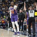 
              Phoenix Suns forward Jae Crowder points to the bench after hitting a 3-point shot late in the second half of the team's NBA basketball game against the Denver Nuggets on Thursday, March 24, 2022, in Denver. (AP Photo/David Zalubowski)
            