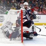 
              Columbus Blue Jackets defenseman Vladislav Gavrikov, right, collides with Washington Capitals goalie Vitek Vanecek, left, in front of Capitals forward Conor Sheary during the second period of an NHL hockey game in Columbus, Ohio, Thursday, March 17, 2022. (AP Photo/Paul Vernon)
            