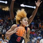 
              Mississippi's Shakira Austin (0) drives to the basket against South Carolina in the first half of an NCAA college basketball semifinal round game at the women's Southeastern Conference tournament Saturday, March 5, 2022, in Nashville, Tenn. (AP Photo/Mark Humphrey)
            
