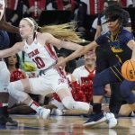 
              California's Leilani McIntosh (1) fouls Utah's Dru Gylten (10) during the first half of an NCAA college basketball game in the first round of the Pac-12 women's tournament Wednesday, March 2, 2022, in Las Vegas. (AP Photo/John Locher)
            