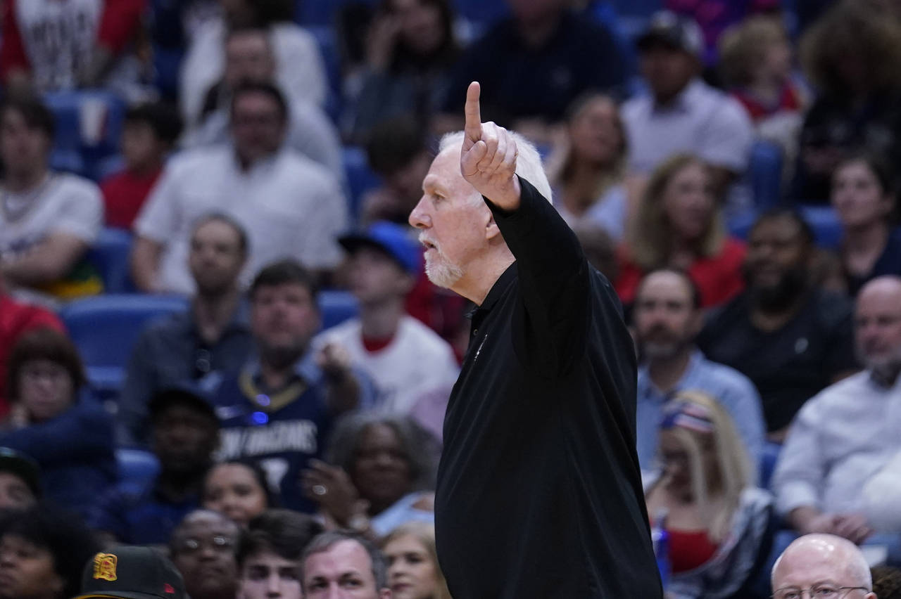 San Antonio Spurs head coach Gregg Popovich calls out from the bench in the second half of an NBA b...