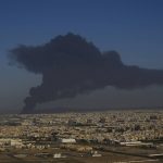 
              A cloud of smoke rises from a burning oil depot in Jiddah, Saudi Arabia, Friday, March 25, 2022. (AP Photo/Hassan Ammar)
            