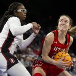 
              Utah forward Jenna Johnson (22) shoots against Stanford forward Francesca Belibi (5) during the first half of an NCAA college basketball game for the Pac-12 tournament championship Sunday, March 6, 2022, in Las Vegas. (AP Photo/Ellen Schmidt)
            