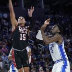 
              Texas Tech guard Kevin McCullar Jr., left, shoots against Duke center Mark Williams during the second half of a college basketball game in the Sweet 16 round of the NCAA tournament in San Francisco, Thursday, March 24, 2022. (AP Photo/Marcio Jose Sanchez)
            