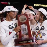 
              Louisville players celebrate after beating Michigan 62-50 in a college basketball game in the Elite 8 round of the NCAA women's tournament Monday, March 28, 2022, in Wichita, Kan. (AP Photo/Jeff Roberson)
            
