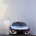 
              William Byron (24) does a burnout to celebrate after winning a NASCAR Cup Series auto race at Atlanta Motor Speedway in Hampton, Ga., Sunday, March 20, 2022. (AP Photo/John Bazemore)
            