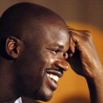 
              FILE - Miami Heat center Shaquille O' Neal smiles while answering questions from reporters during a news conference at the Heat Media day on Oct. 4, 2004, in Miami. (AP Photo/David Adame, File)
            