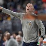
              Denver Nuggets head coach Michael Malone directs his team against the Toronto Raptors in the first half of an NBA basketball game Saturday, March 12, 2022, in Denver. (AP Photo/David Zalubowski)
            