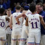 
              Kansas head coach Bill Self congratulates his starters during the second half of a college basketball game in the Elite 8 round of the NCAA tournament Sunday, March 27, 2022, in Chicago. (AP Photo/Charles Rex Arbogast)
            