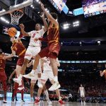 
              Wisconsin's Jahcobi Neath loses the ball between Iowa State's Caleb Grill and Gabe Kalscheur during the second half of a second-round NCAA college basketball tournament game Sunday, March 20, 2022, in Milwaukee. (AP Photo/Morry Gash)
            