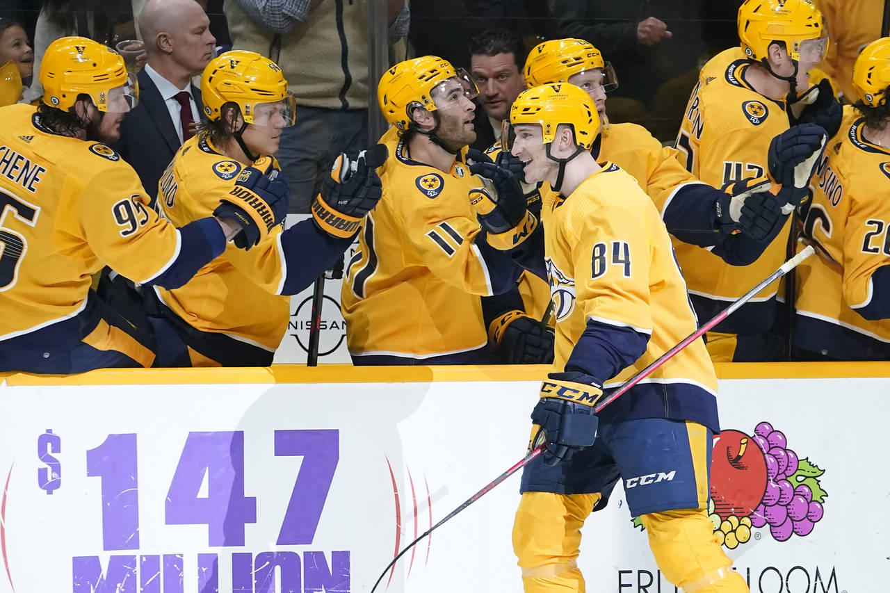 Nashville Predators' Tanner Jeannot (84) is congratulated after scoring a goal against the Toronto ...