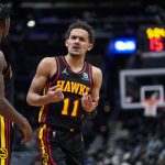 
              Atlanta Hawks guard Trae Young (11) argues a call during the first half of the team's NBA basketball game against the Washington Wizards, Friday, March 4, 2022, in Washington. (AP Photo/Evan Vucci)
            