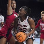 
              Howard forward Kaiya Creek (22) looks for a shot against Incarnate Word forward Jamie Means, left, during the first half of a First Four game in the NCAA women's college basketball tournament Wednesday, March 16, 2022, in Columbia, S.C. (AP Photo/Sean Rayford)
            