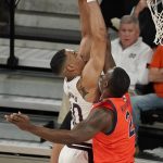 
              Mississippi State forward Garrison Brooks (10) stretches over Auburn forward Jaylin Williams (2) as he attempts a shot at the basket during the first half of an NCAA college basketball game in Starkville, Miss., Wednesday, March. 2, 2022. Auburn won in overtime 81-68. (AP Photo/Rogelio V. Solis)
            