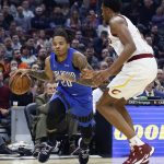 
              Orlando Magic's Markelle Fultz (20) drives against Cleveland Cavaliers' Evan Mobley, right, during the first half of an NBA basketball game, Monday, March 28, 2022, in Cleveland. (AP Photo/Ron Schwane)
            